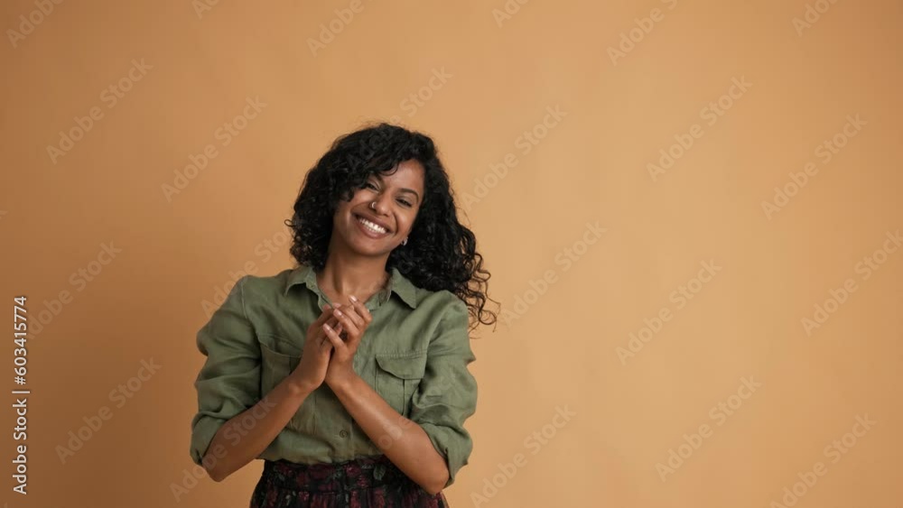 Young black girl with long cute curly hair. Girl who is happy, dancing, hands up. Smiley face. Young black girl with long cute curly hair. Girl who is happy, dancing, hands up. Smiley face.