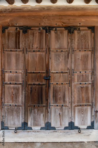 Chinese traditional style wooden door on stone wall
