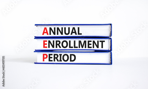 AEP symbol. Concept words AEP Annual enrollment period on beautiful books. Beautiful white table white background. Medical and AEP Annual enrollment period concept. Copy space.