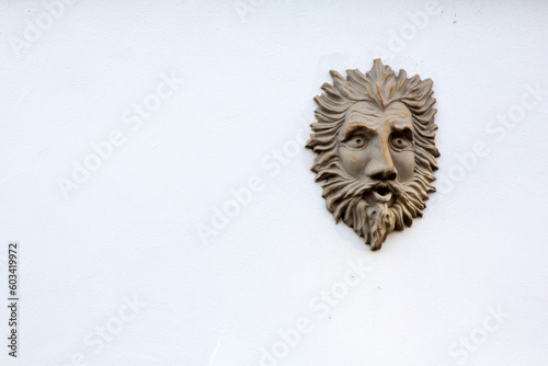 Brass knocker on white door