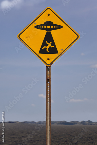 Photography Road sign warning of alien abduction