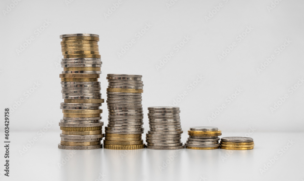 Stacks of coins on a white background Stacks of coins on a white background