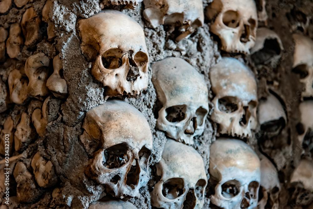 Skulls on the wall of Capela dos Ossos or Chapel of Bones in Evora, Alentejo, Portugal