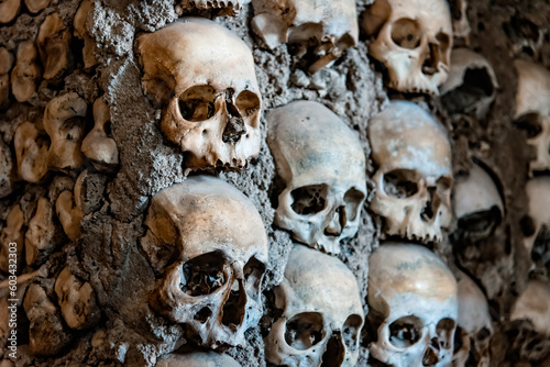 Skulls on the wall of Capela dos Ossos or Chapel of Bones in Evora, Alentejo, Portugal © jjfarq