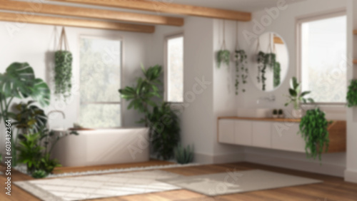 Blurred background  modern wooden bathroom with bathtub and washbasin. Parquet and carpets. Biophilic concept  many houseplants. Urban jungle interior design