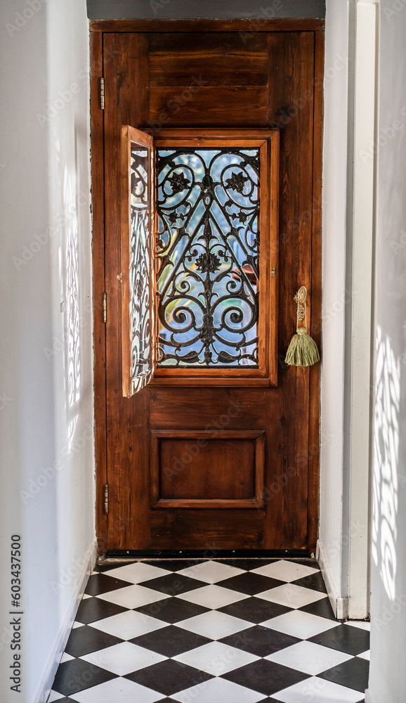 Trendy wooden front door from the inside house