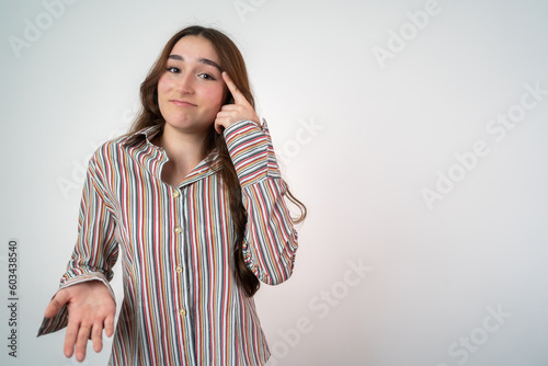 Positive young girl think choice creative on white background. Smile girl thinking about question, pensive expression something over isolated.