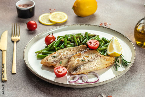 Baked white fish fillet Pangasius or tilapia with vegetables. banner, menu, recipe place for text, top view