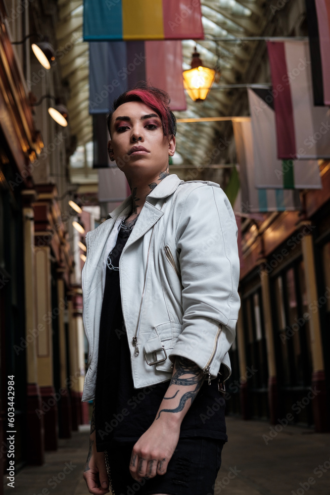 Androgynous non-binary model posing indoors. Androgynous non-binary model posing indoors.