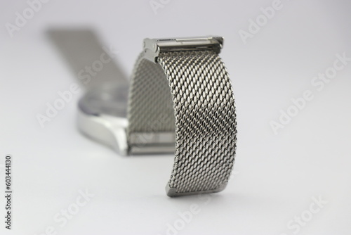 Watch strap made from stainless steel links on a white background