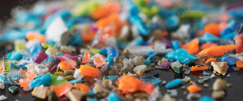 Extreme macro shot on a pile of micro plastic particles. Concept for water pollution and global warming.