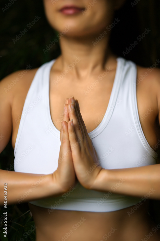 Portrait of Asian American woman in fitness attire standing in yoga position. Portrait of Asian American woman in fitness attire standing in yoga position.