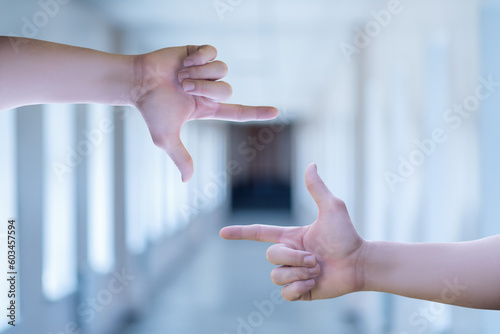 Hands show a crop gesture.