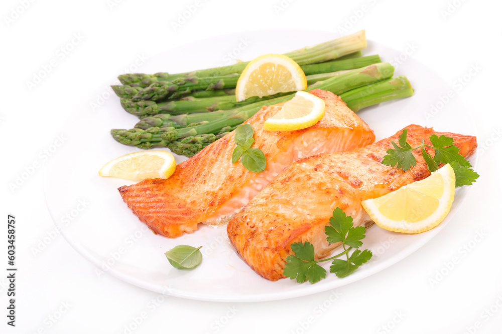 grilled salmon with asparagus and lemon- plate isolated on white background grilled salmon with asparagus and lemon- plate isolated on white background