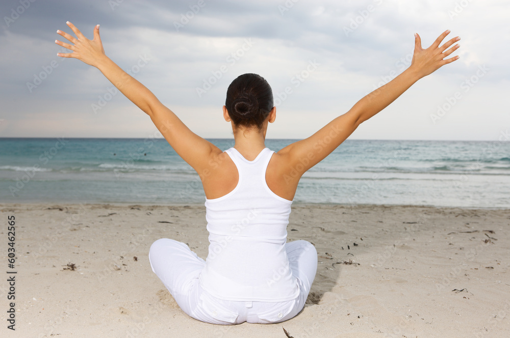 Young beautiful woman during fitness on sea beach Young beautiful woman during fitness on sea beach
