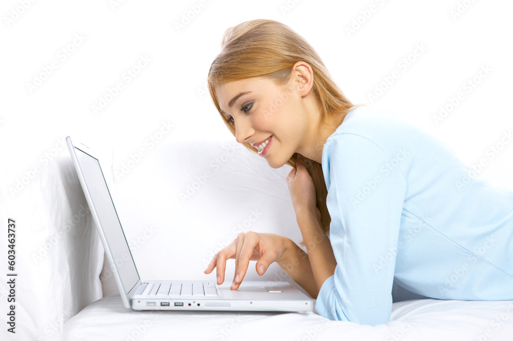 Young woman sitting on couch and working on laptop Young woman sitting on couch and working on laptop