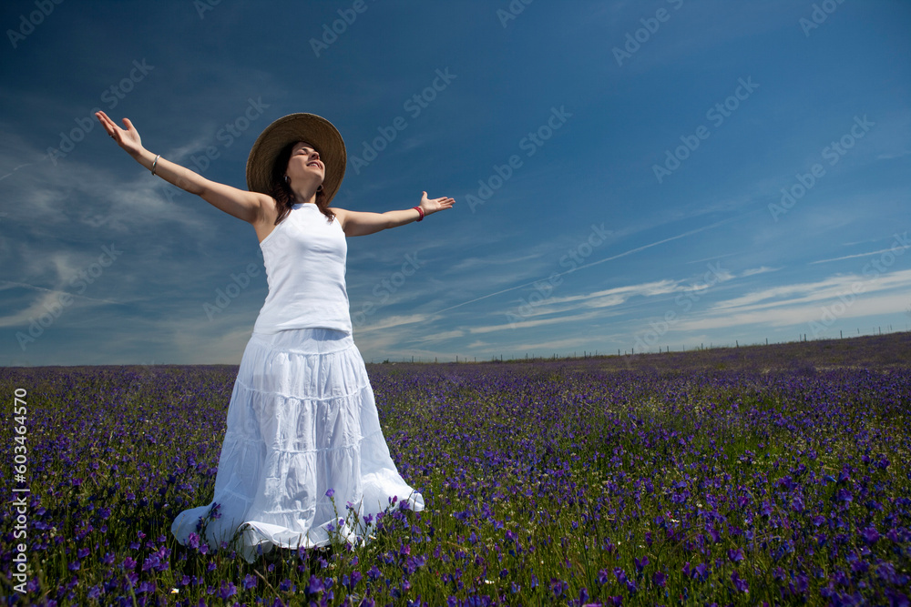 beautiful woman in white dress with arms wide open beautiful woman in white dress with arms wide open