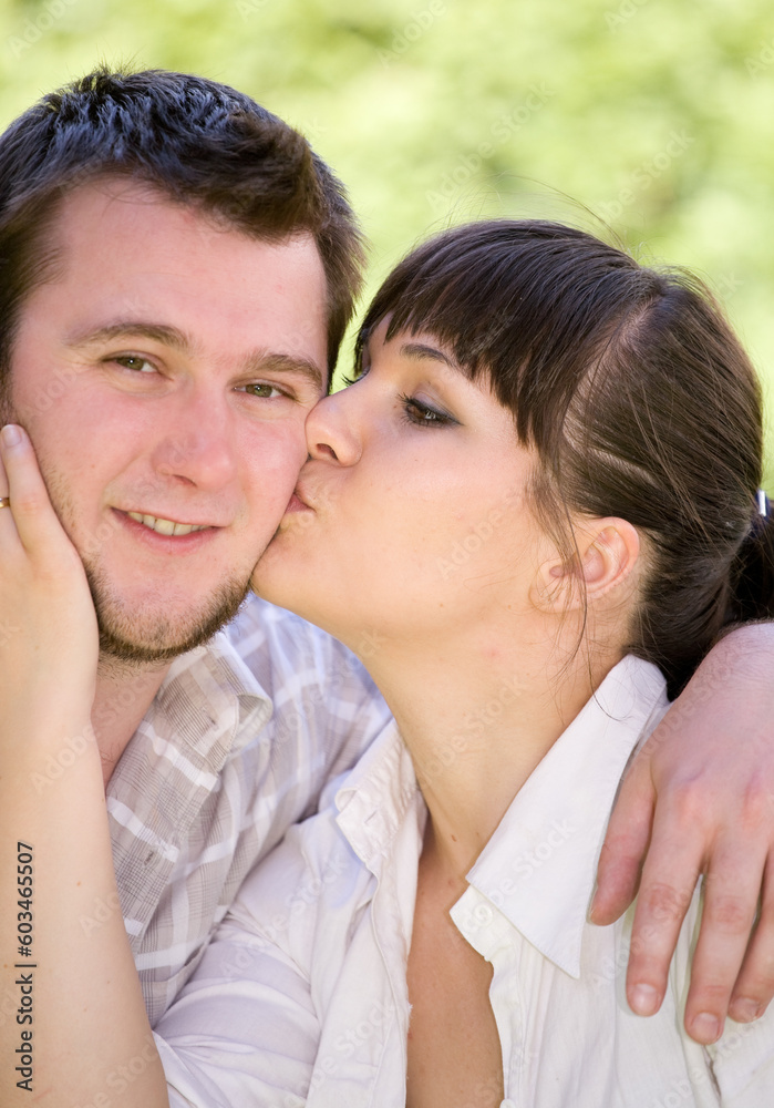 happy couple together sitting on grass happy couple together sitting on grass