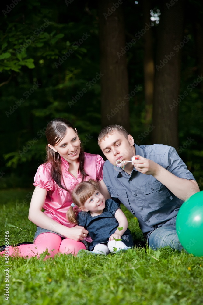 Fototapeta premium Happy Family Portrait On The Nature Background
