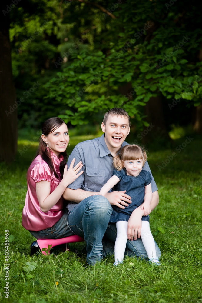 Happy Family In The Summer Park