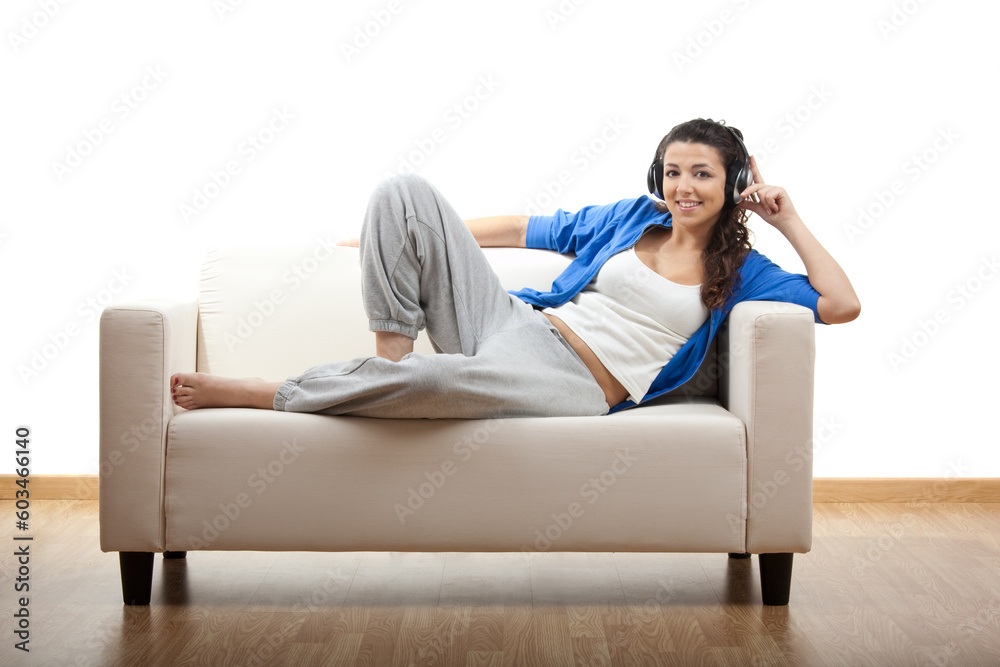 Portrait of a girl lying on the couch and making a phone call Portrait of a girl lying on the couch and making a phone call