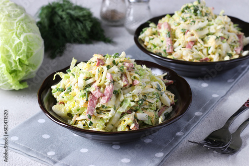 Salad with Chinese cabbage, eggs, cheese and sausage, dressed with mayonnaise