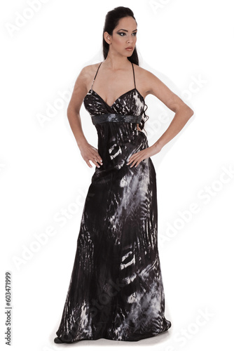 Beautiful woman in a full black costume over white background