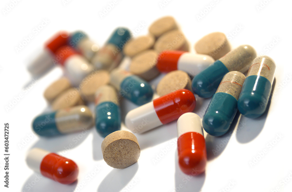 Tablets and pills isolated on the white background