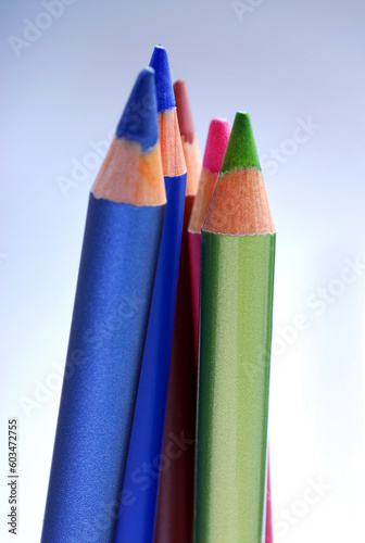 different cosmetic pencils on the white background