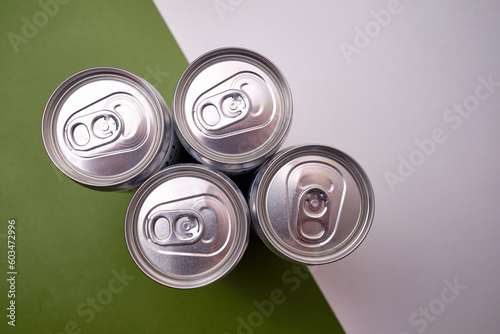 Empty soda can, focus on drink on light background. Place for text and information
