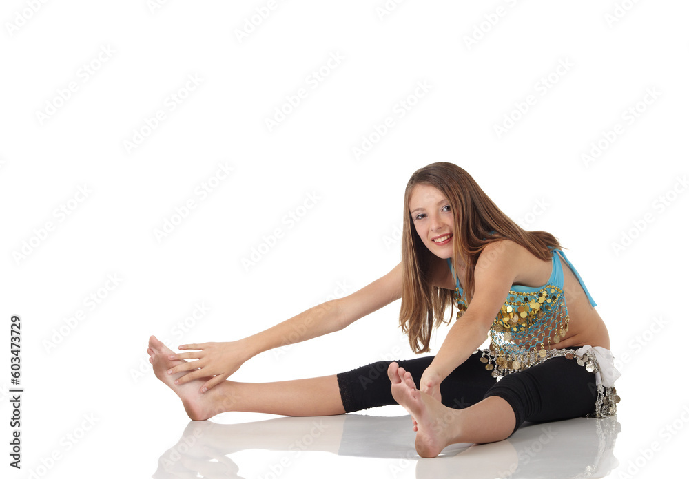Young Caucasian belly dancing girl in beautiful decorated clothes on white background and reflective floor. Not isolated