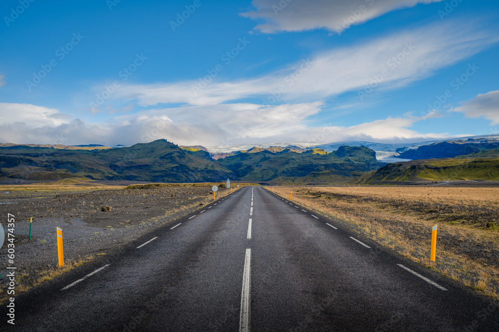 Typical roads of Iceland on a summer day, leading to mountains and glaciers. Typical roads of Iceland on a summer day, leading to mountains and glaciers.