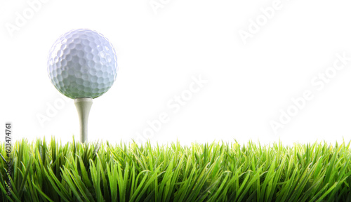Golf ball with tee in the grass on white
