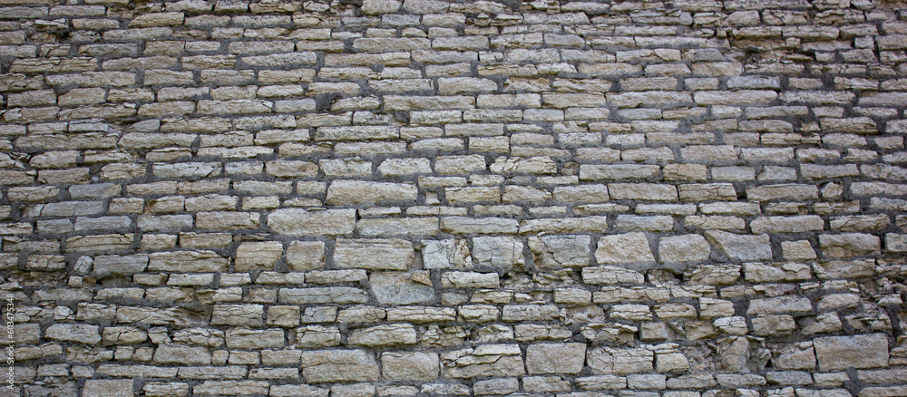 Old brickwork wall. Ancient masonry wall. Antique masonry wall.