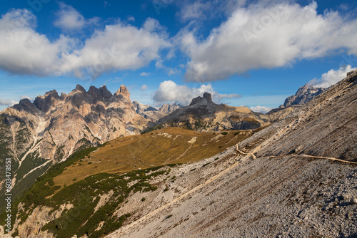 Landscape in the Italian Dolomites Tre Cime. There is a clear blue sky and somewhere there are clouds.