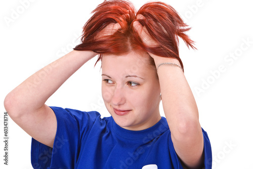 Image of a redheaded girl expressing a reaction to an unexpected mistake.Shot with Canon 70-200mm f/2.8L IS USM photo