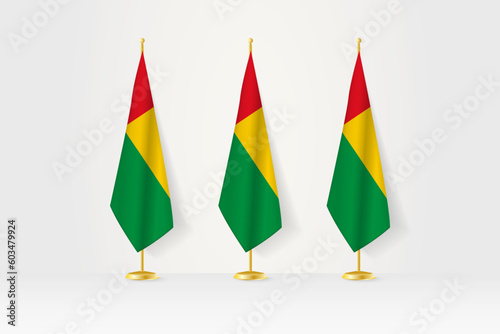 Three Guinea-Bissau flags in a row on a golden stand, illustration of press conference and other meetings.