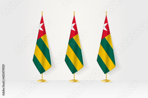 Three Togo flags in a row on a golden stand, illustration of press conference and other meetings.