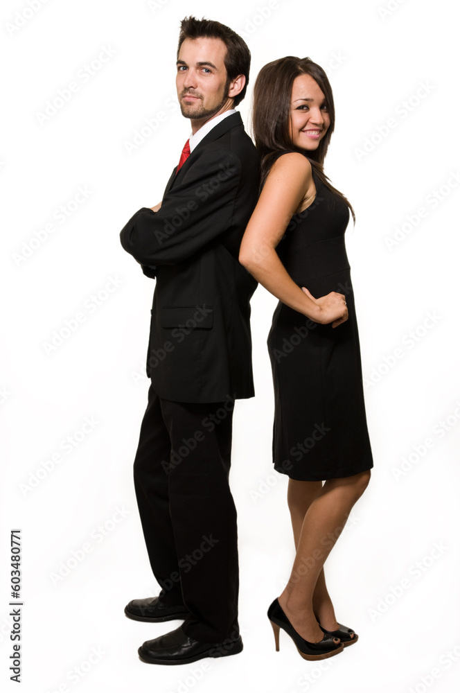 Full body of an attractive brunette business woman and man standing back to back over white Full body of an attractive brunette business woman and man standing back to back over white