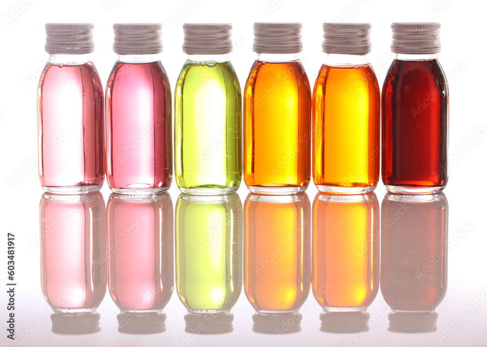 bottles with essential oils isolated on white background bottles with essential oils isolated on white background
