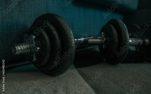 Dumbbells on a wooden floor. Close-up.