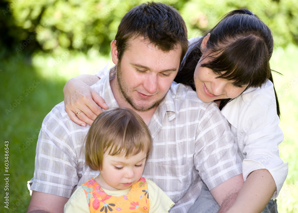 mother, father and daughter together in park mother, father and daughter together in park
