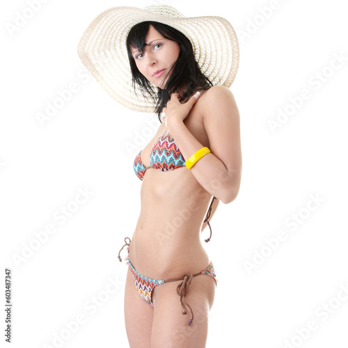 Beautiful brunette with summer hat in bikini