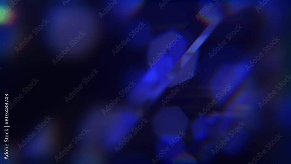 A shimmering black and blue soothing background. Refracted light.