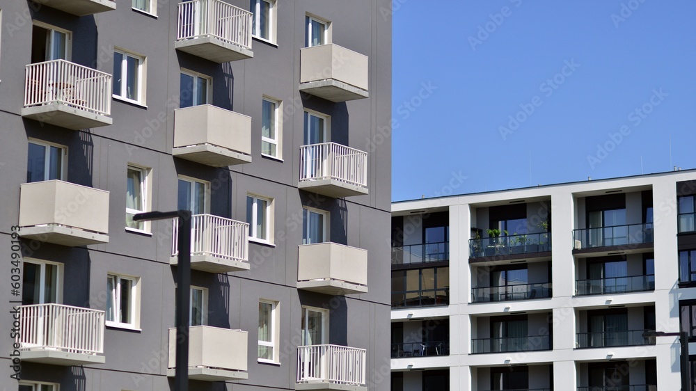 Apartment building with bright facades. Modern minimalist architecture with lots of square glass windows and balconies. Apartment building with bright facades. Modern minimalist architecture with lots of square glass windows and balconies.