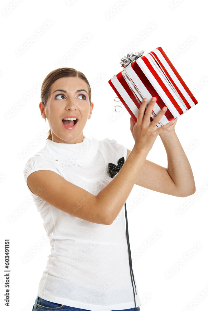 Beautiful woman holding a gift, isolated on white background Beautiful woman holding a gift, isolated on white background