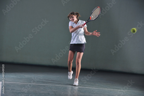 young girl exercise tennis sport indoor © Designpics