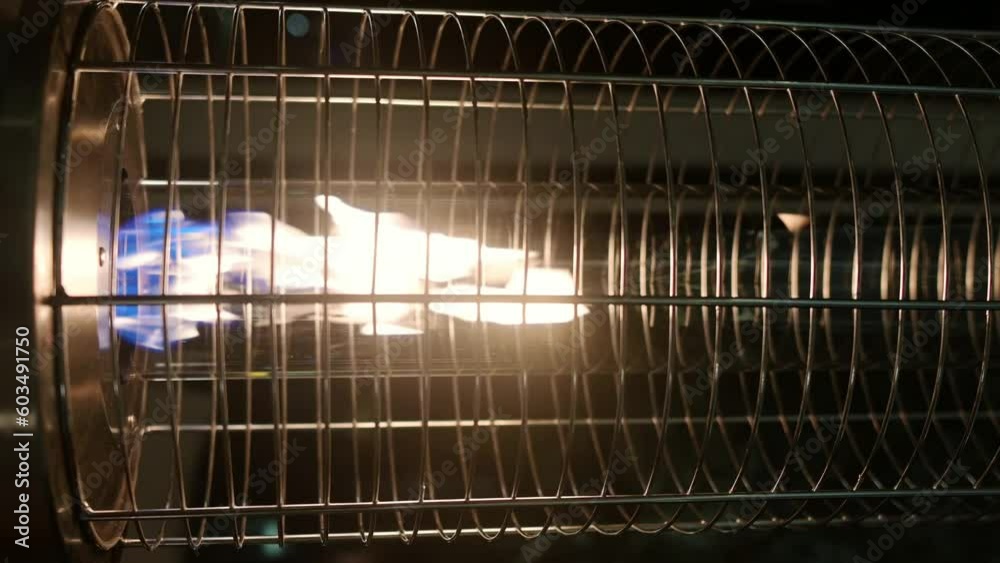 Vertical video of street gas heater in a outside patio of cafe or restaurant at night time. Burning open fire. Vertical video of street gas heater in a outside patio of cafe or restaurant at night time. Burning open fire.