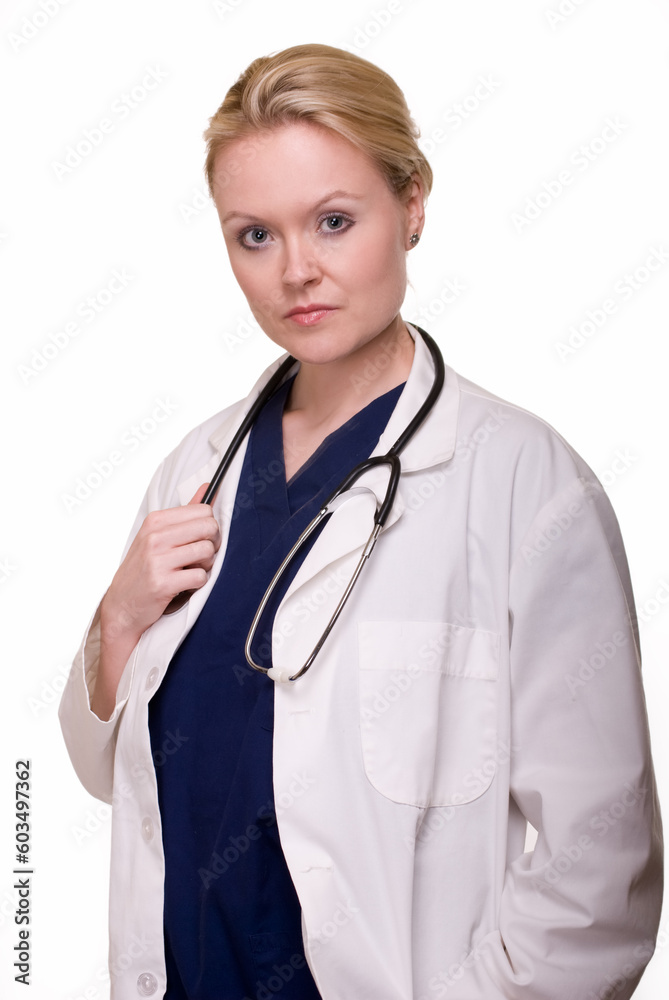 Attractive blond woman doctor wearing scrubs and white lab coat with stethoscope with serious expression on white Attractive blond woman doctor wearing scrubs and white lab coat with stethoscope with serious expression on white