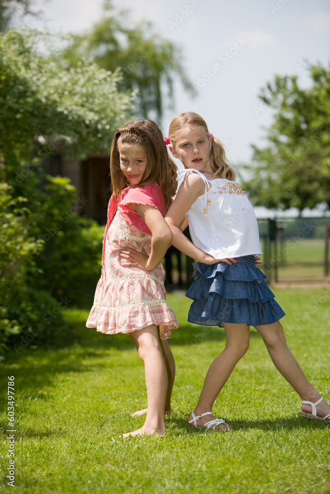 Two young girls having fun posing as real models Two young girls having fun posing as real models